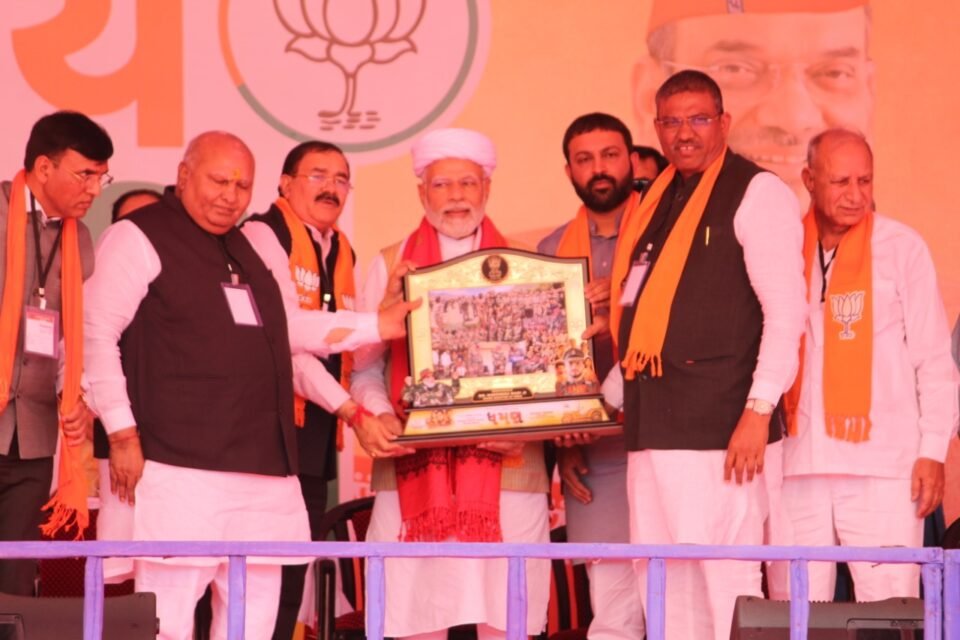 Upcoming Dhaman Gujarati movie's producer Bhupat Bodar presents memento to PM Modi behalf of his Dhaman team 